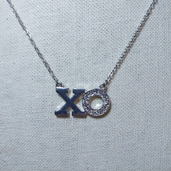 Sterling silver plated  CLAIRS clear sustainable XO pendant necklace 14 in