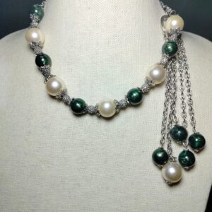 A unique green and white plastic pearls necklace