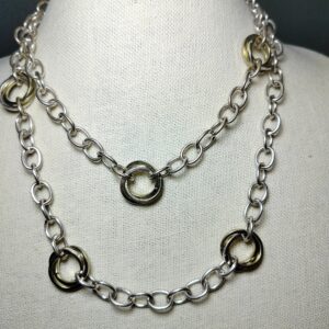 A lovely long strand silver and gold tone necklace