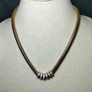 A magnet locket gold tone necklace