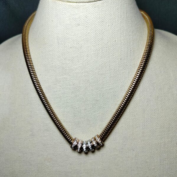 A magnet locket gold tone necklace