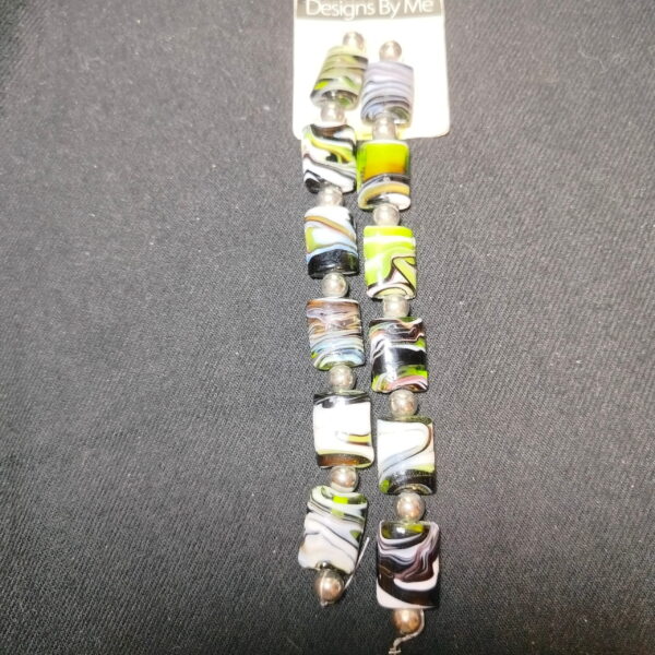 Handmade beads signed Designs By Me 26pcs