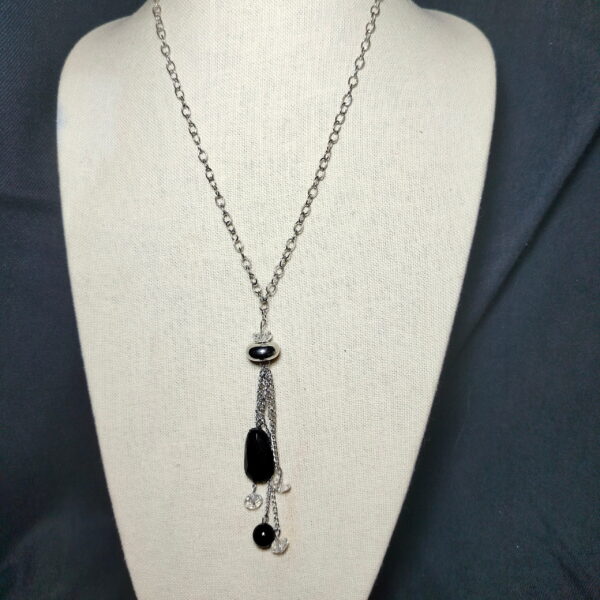Silver tone necklace with black pendants