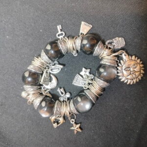 A bracelet with multi pendants and black beads