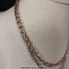 Elegant Layered Gold Chain Necklace with Rustic Crystal Pendant - Image 3