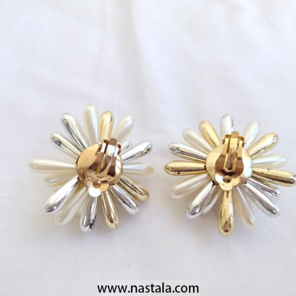 A pair of flower-shaped earrings with gold and silver accents | أقراط بتصميم زهري مع تفاصيل ذهبية وفضية - Image 2