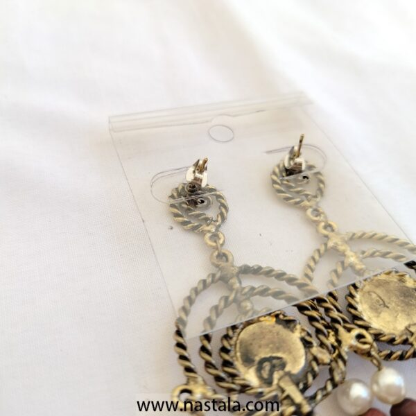 A pair of vintage-style earrings with blue accents and dangling beads | أقراط بتصميم قديم مع لمسات زرقاء وخرز متدلي - Image 3
