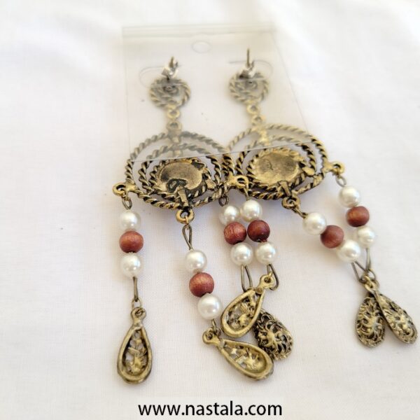 A pair of vintage-style earrings with blue accents and dangling beads | أقراط بتصميم قديم مع لمسات زرقاء وخرز متدلي - Image 2