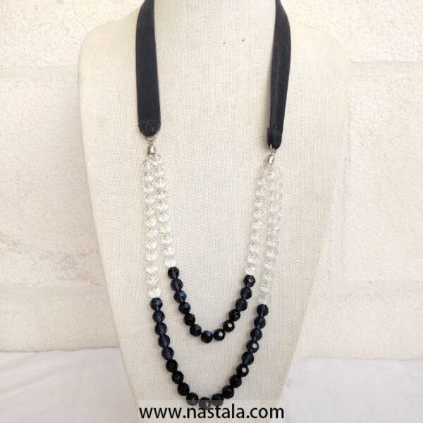 A layered necklace with black and clear beads | قلادة متعددة الطبقات مع خرز أسود وشفاف