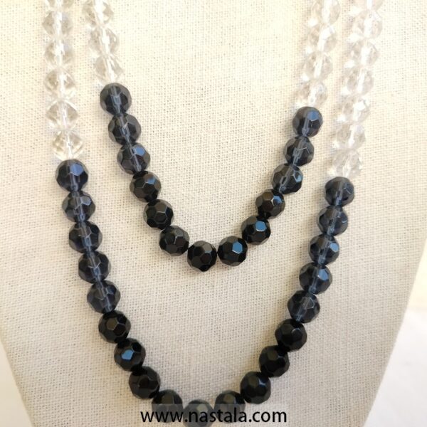 A layered necklace with black and clear beads | قلادة متعددة الطبقات مع خرز أسود وشفاف - Image 5