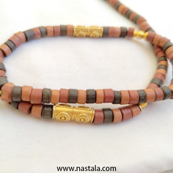 A necklace with colorful cylindrical beads and golden accents | قلادة مع خرز أسطواني ملون وتفاصيل ذهبية - Image 2
