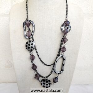 A bold necklace with spotted pendants and purple geometric beads | قلادة جريئة مع قلادات مزخرفة بنقاط وخرز هندسي بنفسجي