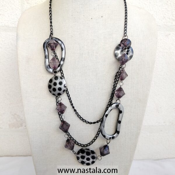 A bold necklace with spotted pendants and purple geometric beads | قلادة جريئة مع قلادات مزخرفة بنقاط وخرز هندسي بنفسجي