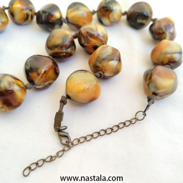 A necklace with large, round plastic beads in warm tones | قلادة من خرز بلاستيكي كبير ودائري بألوان دافئة - Image 4