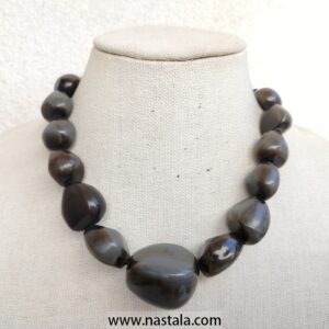 A necklace made with polished obsidian beads | قلادة مصنوعة من خرز الأوبسيديان المصقول