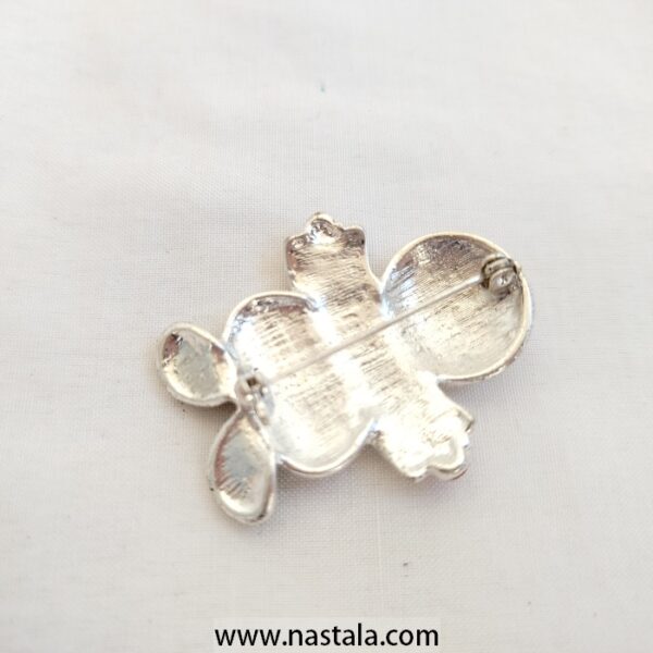 A festive snowman pin with a "Believe" banner | دبوس مزخرف على شكل رجل ثلج مع لافتة "Believe" - Image 2