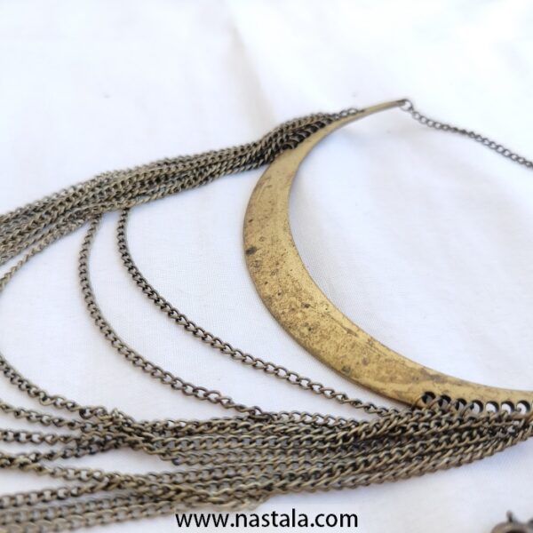 A boho-style necklace with layered chains and a crescent pendant | قلادة بأسلوب بوهيمي مع سلاسل متعددة وقلادة هلالية - Image 2