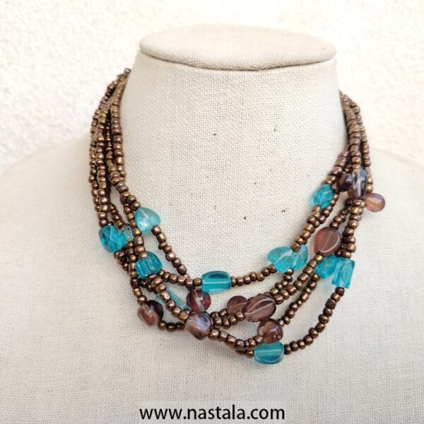 A multi-strand necklace with turquoise and brown beads | قلادة متعددة الخيوط مع خرز تركوازي وبني