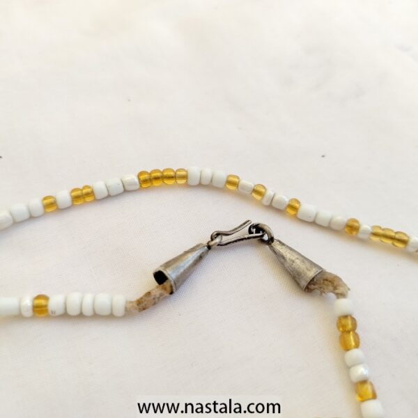 A double-strand necklace with white and gold beads | قلادة ذات خيطين من الخرز الأبيض والذهبي - Image 2