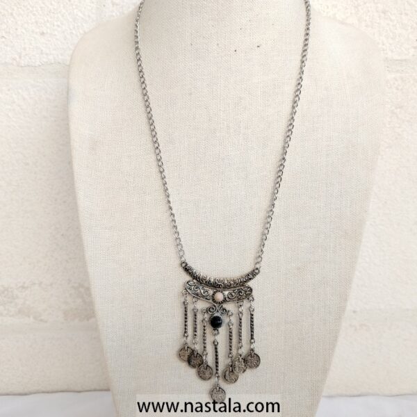 A vintage-style silver necklace with dangling coins | قلادة فضية بتصميم قديم مع عملات متدلية