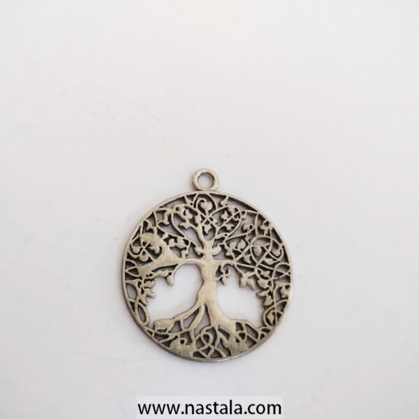 A pendant featuring a tree of life design | قلادة مع تصميم شجرة الحياة