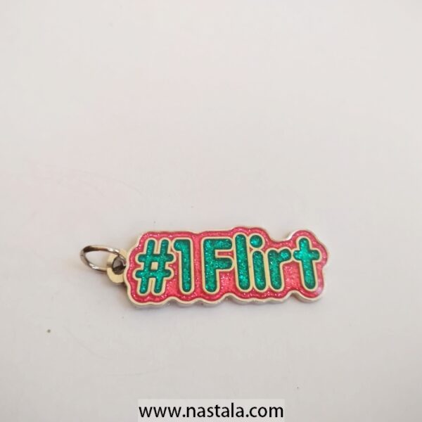 A playful "#1 Flirt" charm | ميدالية مرحة مكتوب عليها "#1 Flirt"
