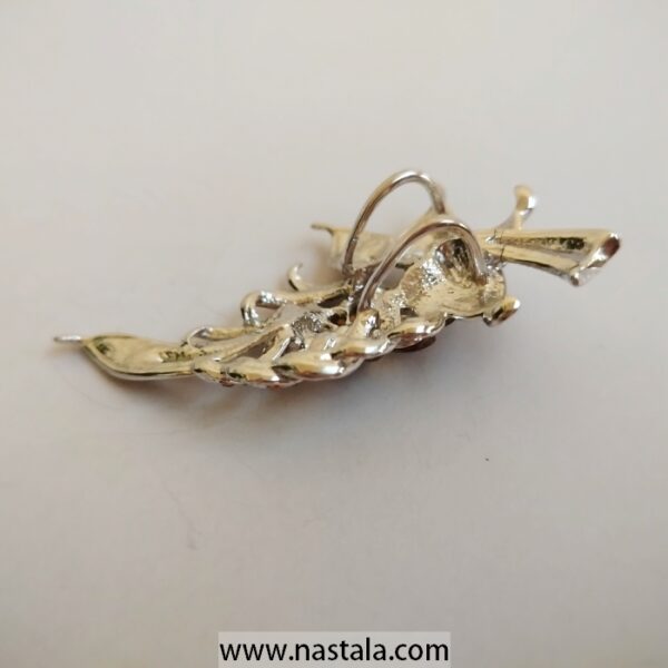 A shimmering floral brooch with amber and clear rhinestones | دبوس مزخرف بشكل زهرة مع أحجار الراين الكهرماني والشفافة - Image 2